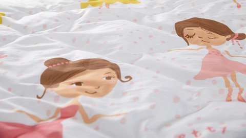 een beddengoed met cartoongezichten erop