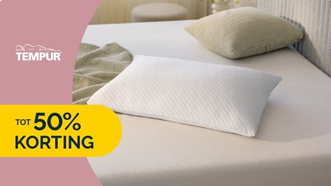 Een wit kussen op een bed