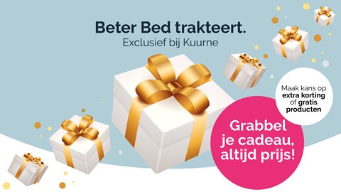 een witte doos met gouden linten