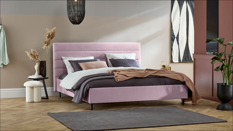 Gestoffeerd bed met boxspringlook roze