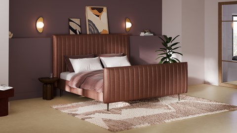 een bed met een plant aan de zijkant