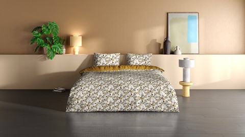 een bed met een plant en een lamp