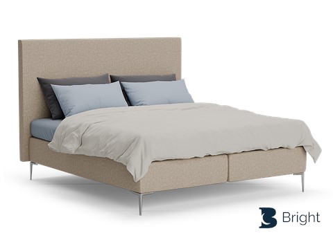 Een bed met een wit dekbed