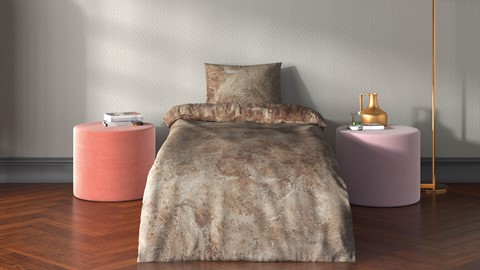 een bed met een kussen en een kussen op een houten vloer