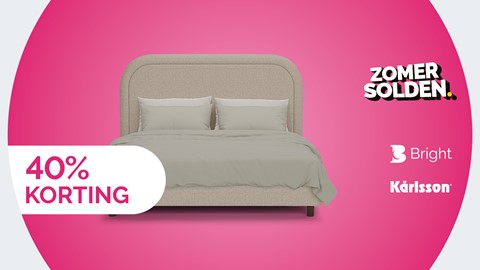 een bed met kussens en een bord